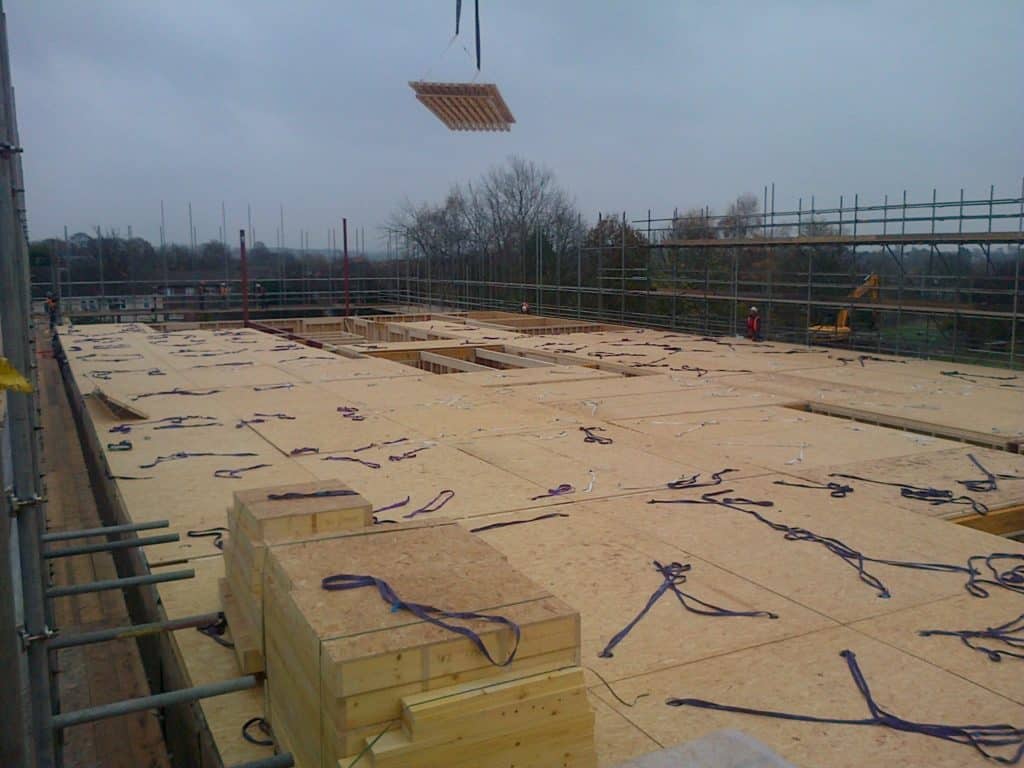 floor cassettes installed on site with one lifted into place by crane