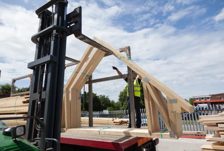 room in roof trusses loaded onto a lorry trailer