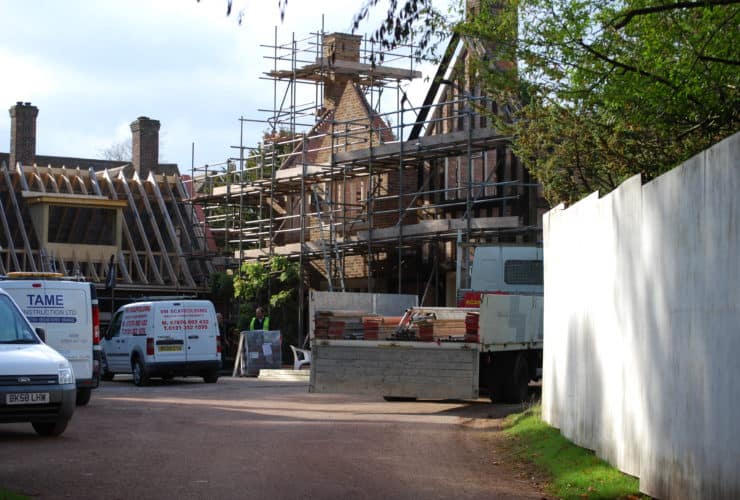 scaffolding erected in front of mansion