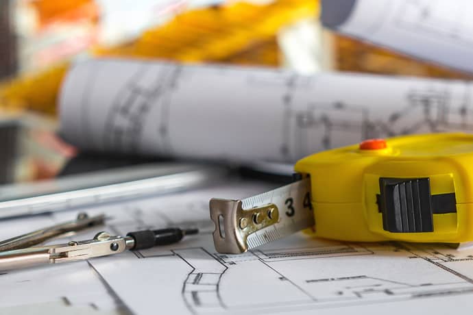 a tape measure on construction plans