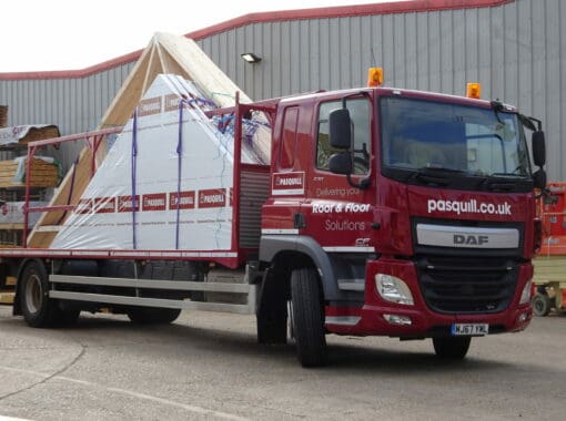 a Pasquill lorry carrying timber roof frames