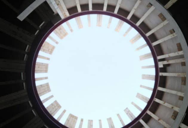 a vertical view of a circular opening in a roof