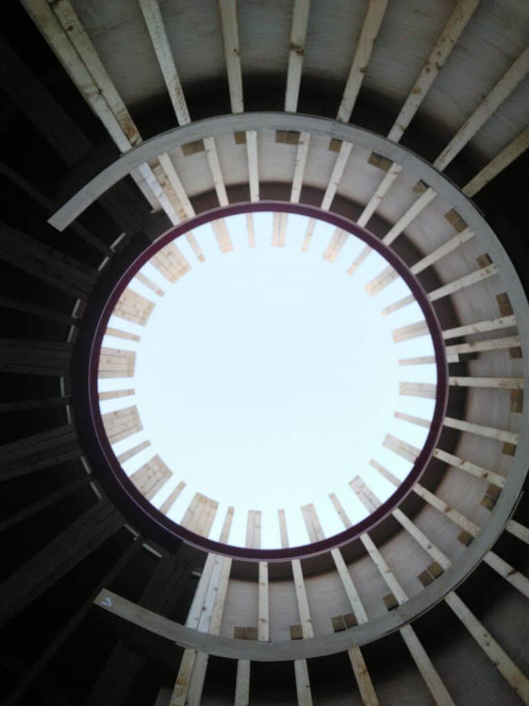 a vertical view of a circular opening in a roof