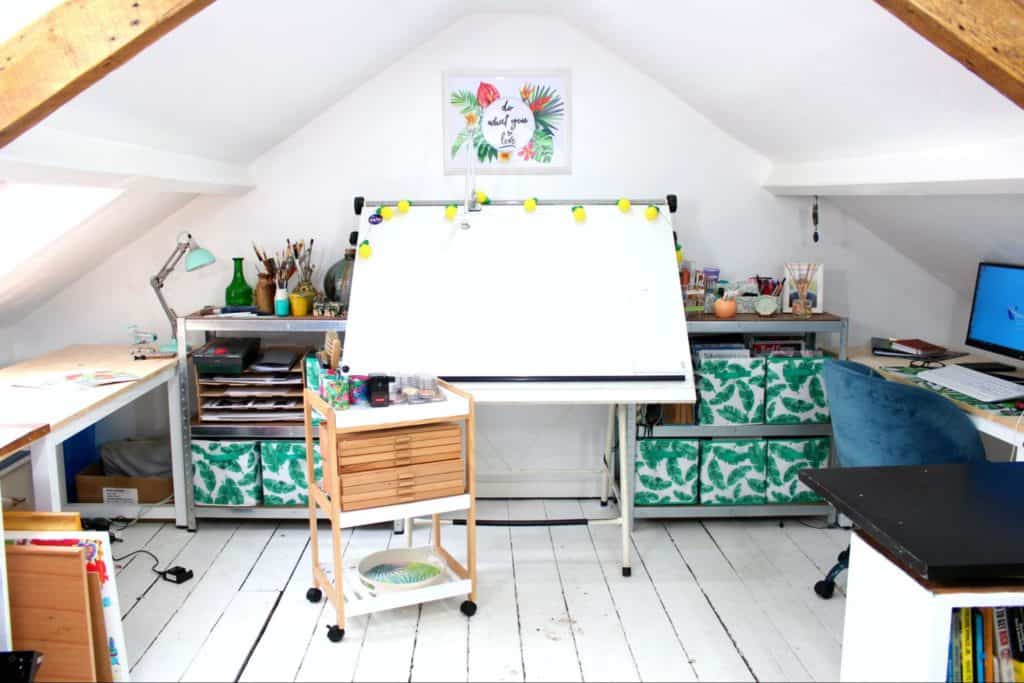 an attic office with an easel in the centre of the room
